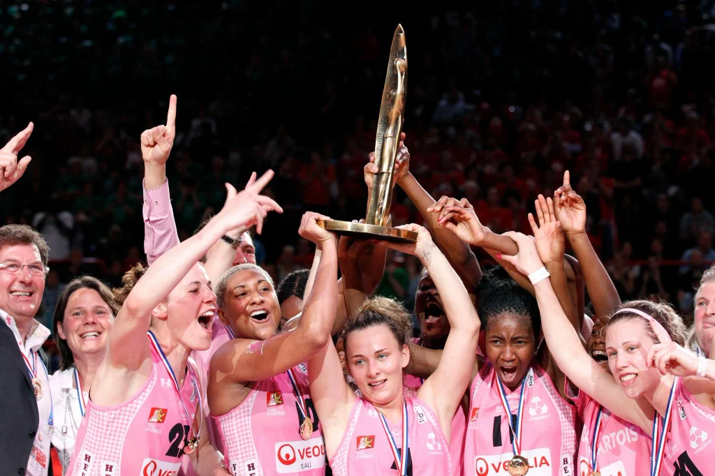 Arras Pays d'Artois women's basketball team celebrating their historic 2012 French Cup victory with the trophy in Paris.