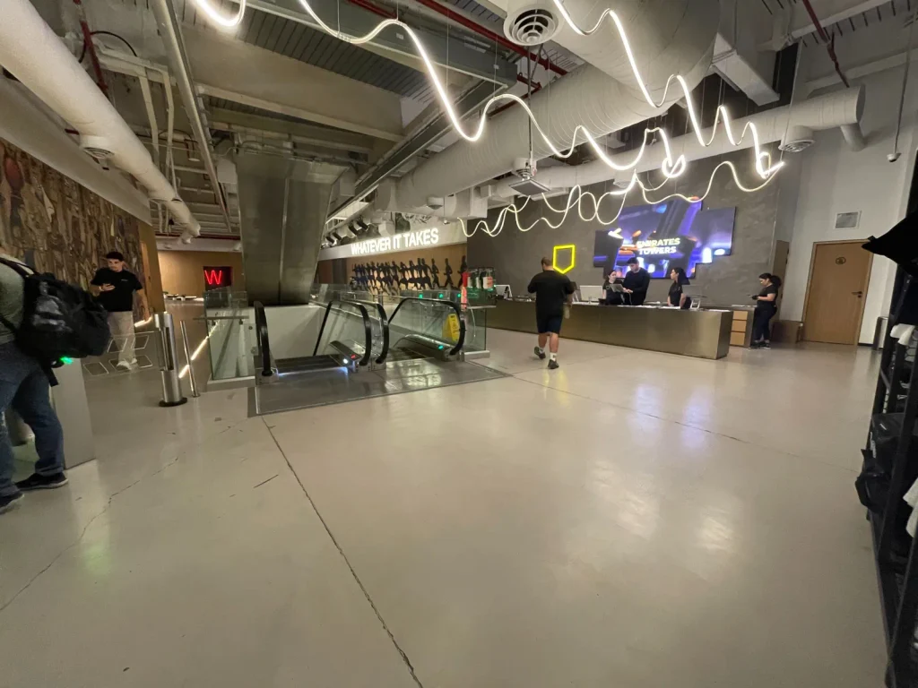 Reception and entrance area of Warehouse Gym Dubai Science Park featuring industrial-style interior design
